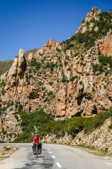 Woman cycle touring in  Yunnan