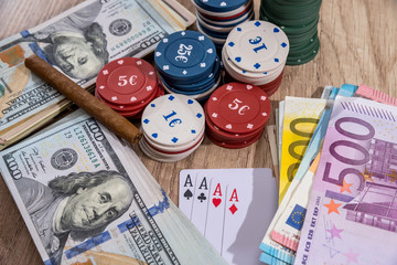 poker combinations - chips, paly card, money on desk.