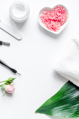 salt and cream for nail care in spa top view