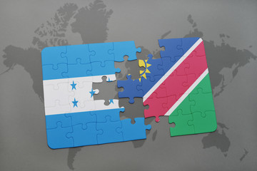 puzzle with the national flag of honduras and namibia on a world map