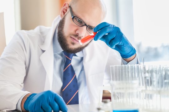 Man researcher carrying out scientific research.