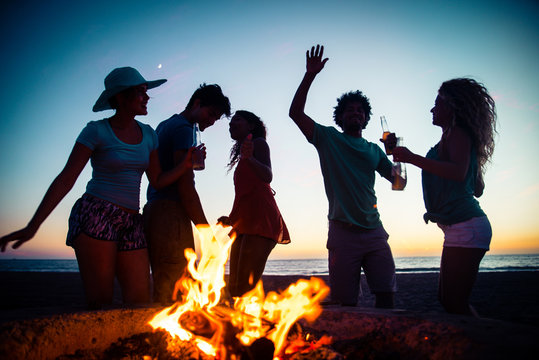 Friends partying on the beach