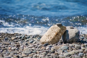 The pebble stones on the beach.