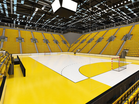 Bbeautiful sports arena for handball with yellow seats and VIP boxes