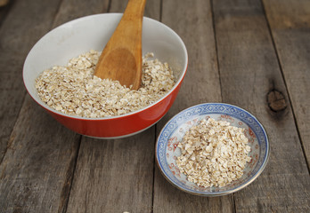 Two dishes of dry oatmeal