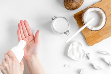 organic cosmetics with coconut on white background top view