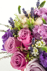 Close-up spring bouquet with pink and purple rose