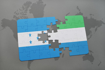 puzzle with the national flag of honduras and sierra leone on a world map
