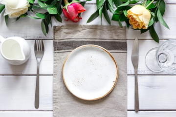 ceramic tableware top view on wooden background mock up