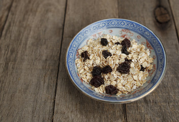 Dry oatmeal with raisins. Healthy food and diet.