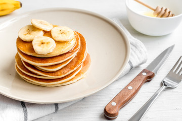 cooked pancake on plate at wooden background