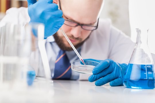 Man researcher carrying out scientific research.
