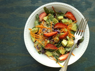 Mixed couscous salad with vegetables and strawberries