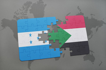 puzzle with the national flag of honduras and sudan on a world map