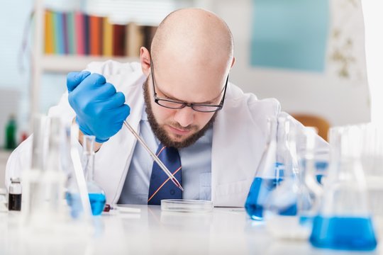 Man researcher carrying out scientific research.
