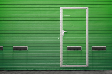 Garage gate with ventilation grilles. Large automatic up and over garage door with inclusion of...