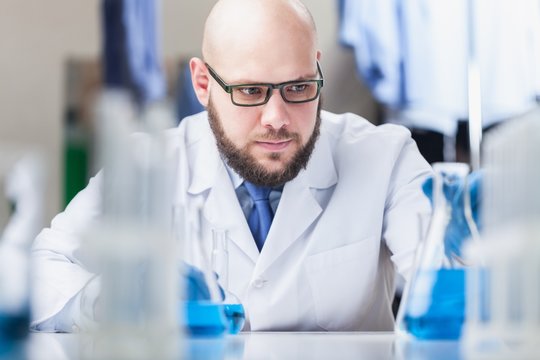 Man researcher carrying out scientific research.