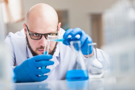 Man researcher carrying out scientific research.