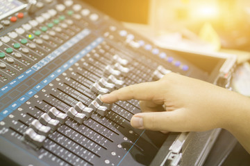 studio working with sound and light mixer console,hands of sound engineer working on recording studio mixer,Expert adjusting the volume of a sound mixer audio mixing console with mixer board,vintage