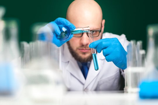 Man researcher carrying out scientific research.