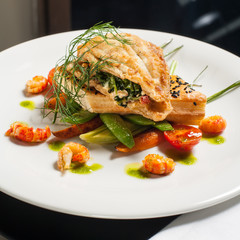 Roasted flounder stuffed with spinach and cauliflower salad, crayfish tales.