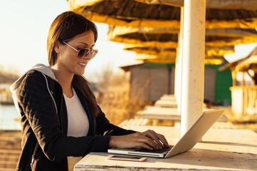 Girl using laptop outdoor