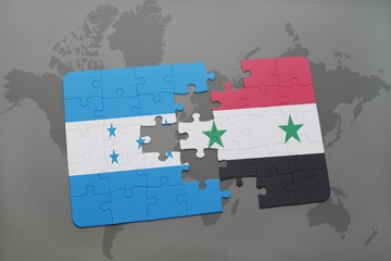 puzzle with the national flag of honduras and syria on a world map