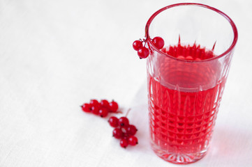 Drink red currant in a beautiful transparent glass