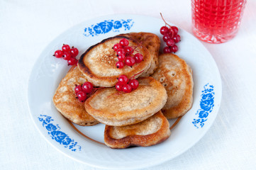 Pancakes with berries red currant, dessert for breakfast