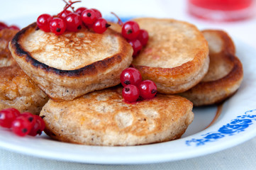 Pancakes with berries red currant, dessert for breakfast
