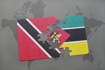 Fototapeta na wymiar puzzle with the national flag of trinidad and tobago and mozambique on a world map
