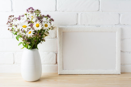 White landscape frame mockup with blooming wildflower bouquet in vase