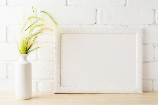 White landscape frame mockup with yellow and green wild grass ears