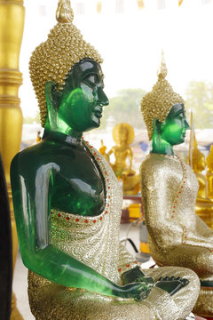 green buddha statue