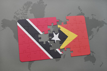 puzzle with the national flag of trinidad and tobago and east timor on a world map