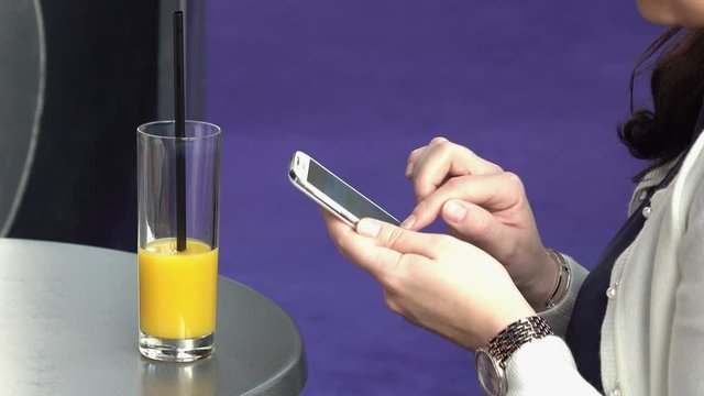 High quality video of woman using mobile phone in 4K
