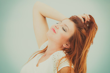 Portrait of beautiful redhead adult woman