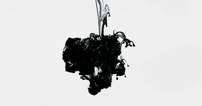 Black ink drop in water filmed in slow motion
