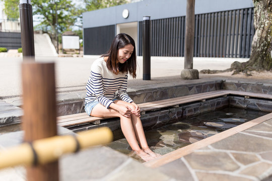 Woman enjoy foot onsen in Japan