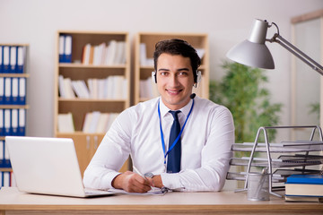 Handsome customer service clerk with headset 