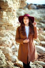 Obraz premium Portrait of the beautiful fashionable girl in a hat outdoor on sunny spring day.