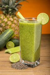 Green juice on wooden board