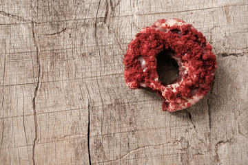 Isolated  bite missing red velvet donut