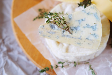 Cheese plate with different kinds of cheese with white wine