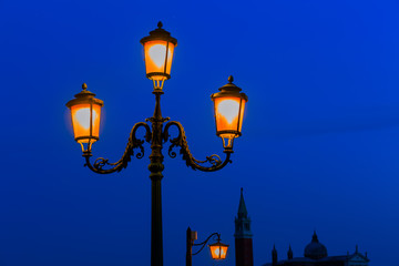 Fototapeta na wymiar old street lamp at night in Venice, Italy