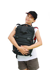 Portrait of young woman traveler with bag going on a journey on white background