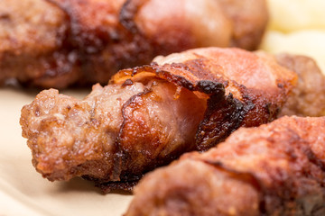 Closeup macro kebabs grilled in bacon