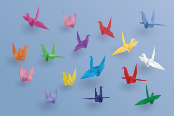 set of paper birds on blue background.the art of origami