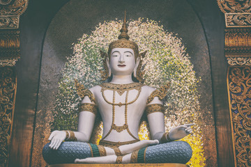Sculpture of Buddha in Thai temple, element of decor and architecture closeup