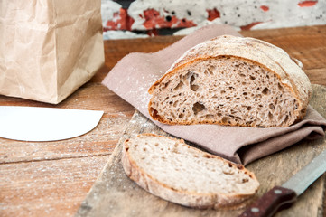 Freshly baked homemade artisan sourdough rye and white flour bread.